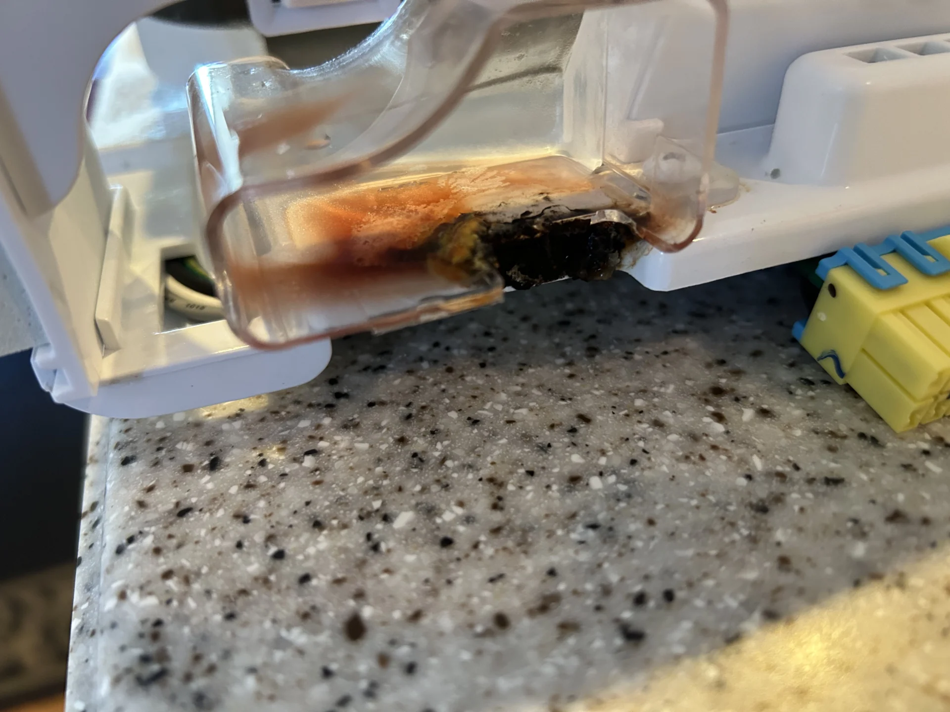 Damaged LG refrigerator door removed due to internal heater malfunction