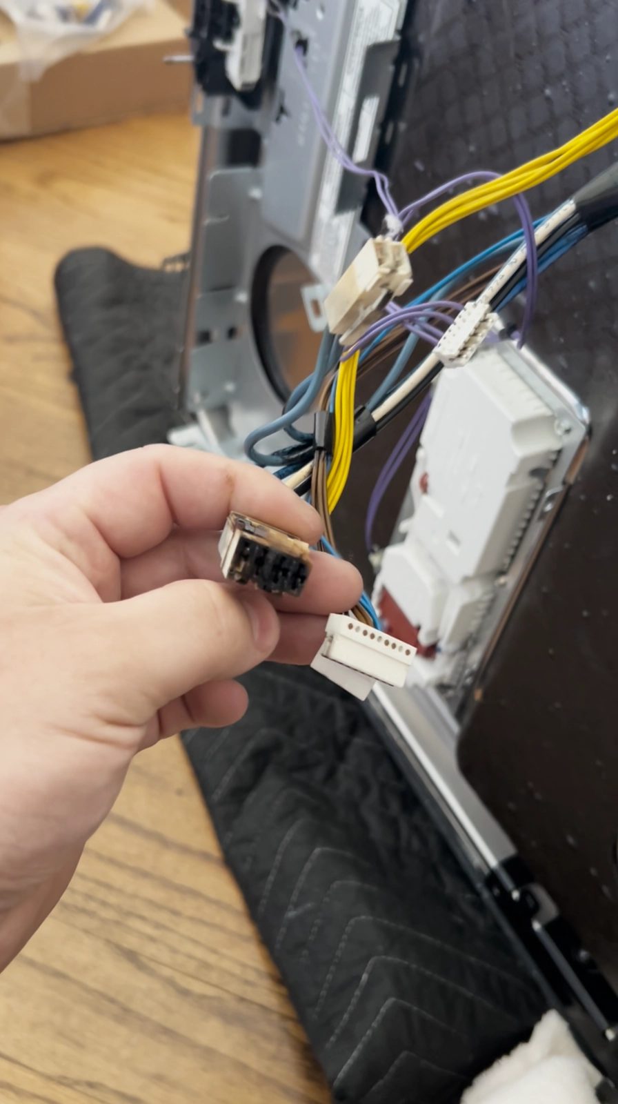 Burnt wiring harness caused by faulty heating element in KitchenAid dishwasher