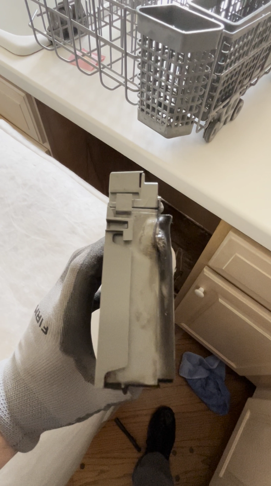 Damaged control board removed from KitchenAid dishwasher due to overheating